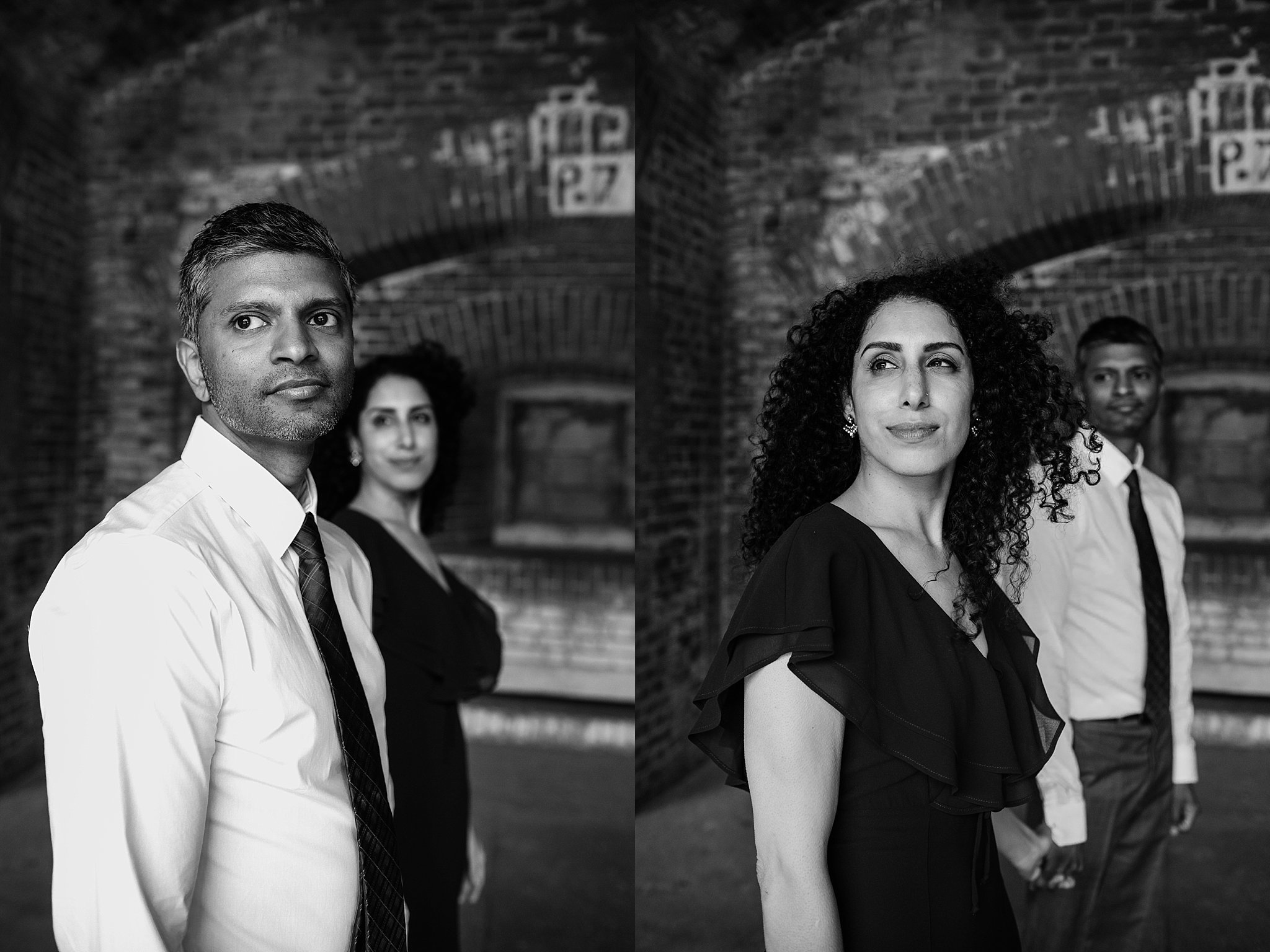 Two black and white images of couple standing below brick arches during their Fort Point engagement photoshoot. In one image the man is in front while the fiance stands in the background looking at him. The second image the woman is in the front while her fiance is gazing at her in the background. 