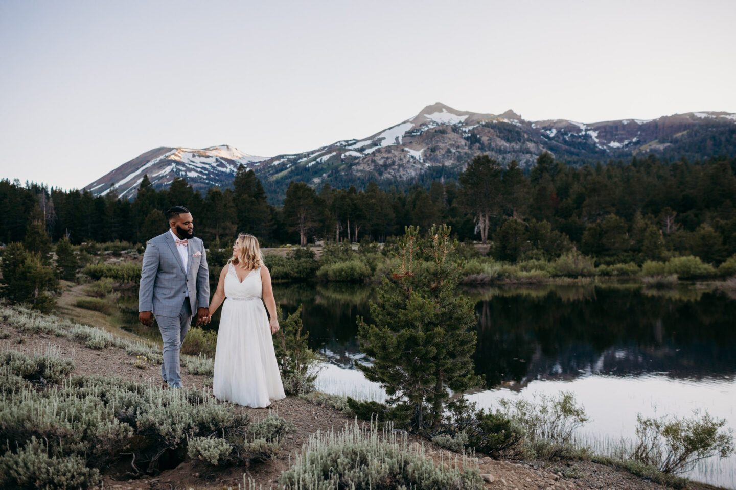tahoe elopement at hope valley bride and groom walking by the lake