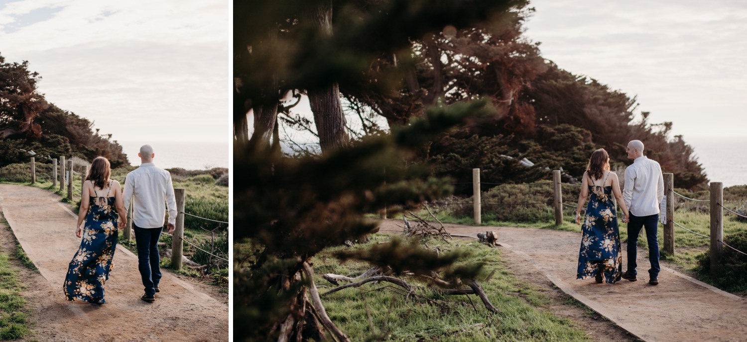 Couple walk holding hands down a dirt path on their Sutro Baths engagement photoshoot.