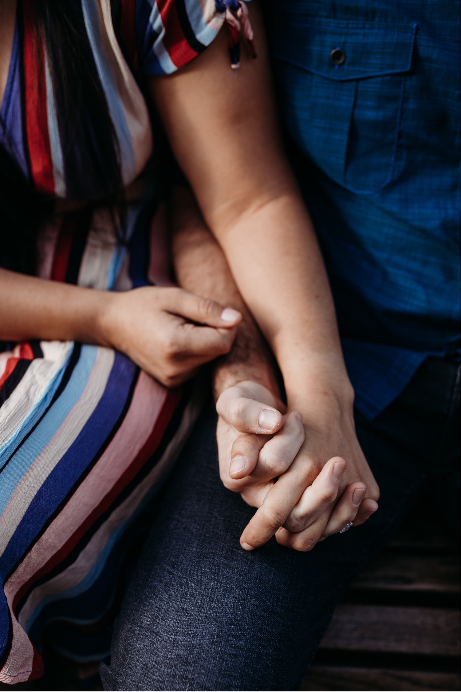 Close up of couple holding hands during their Davis, CA engagement photos.