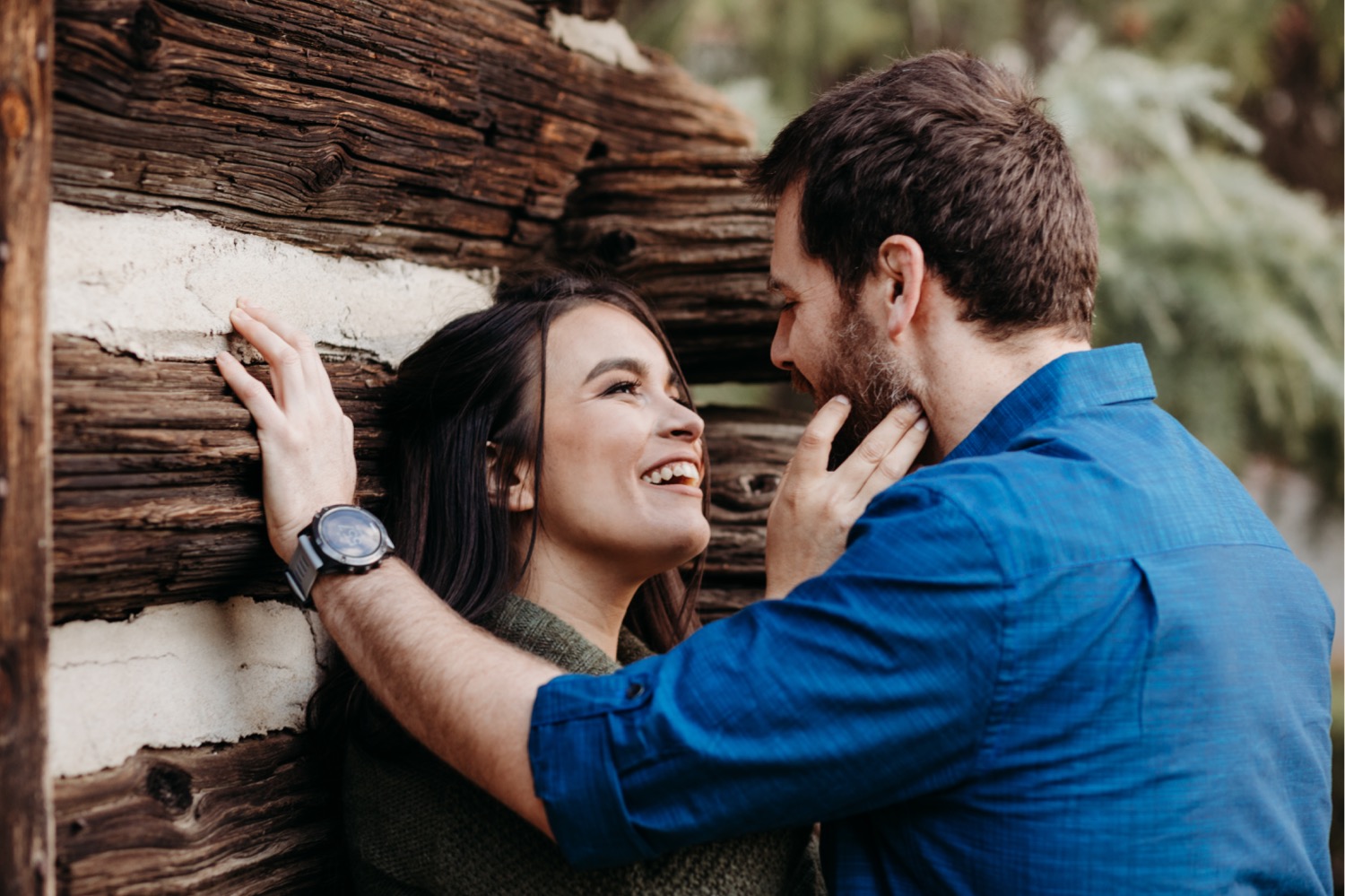 Couple gaze at each other smiling during their Davis engagement photos.