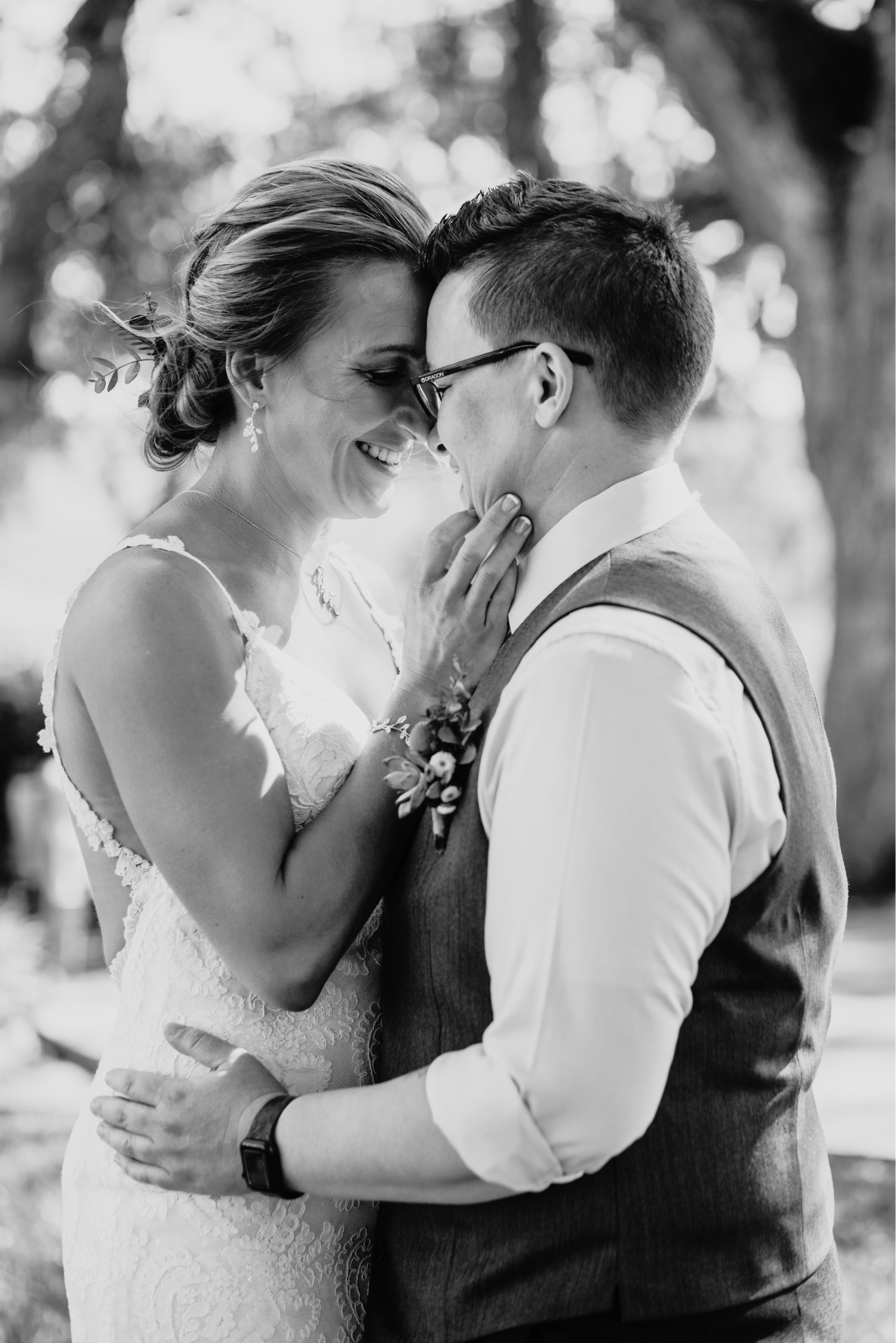 Brides touch each others foreheads in an embrace. Liz Koston Photography.