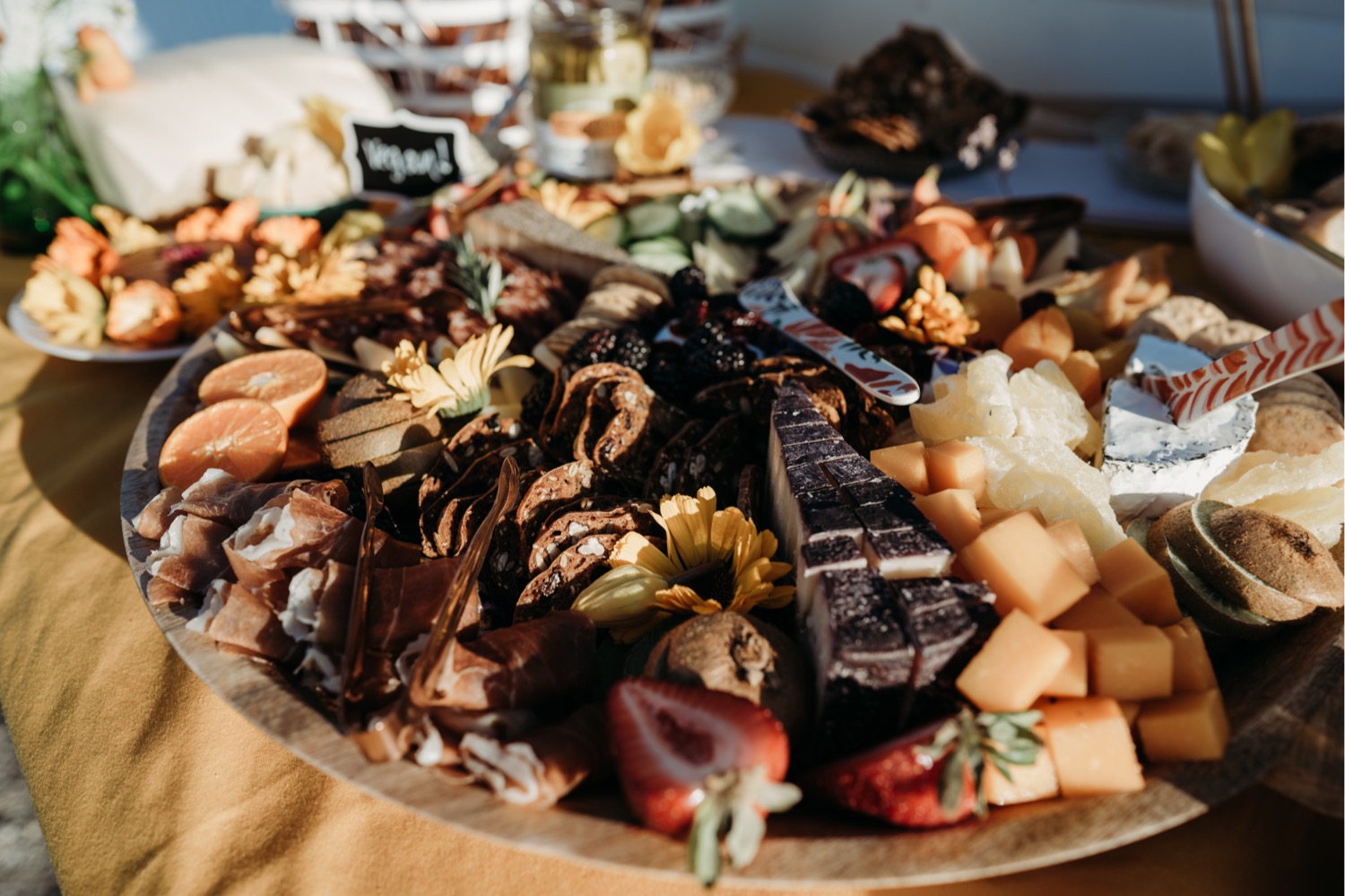 Plate filled with a variety of meat, cheese, and fruit. Liz Koston Photography.