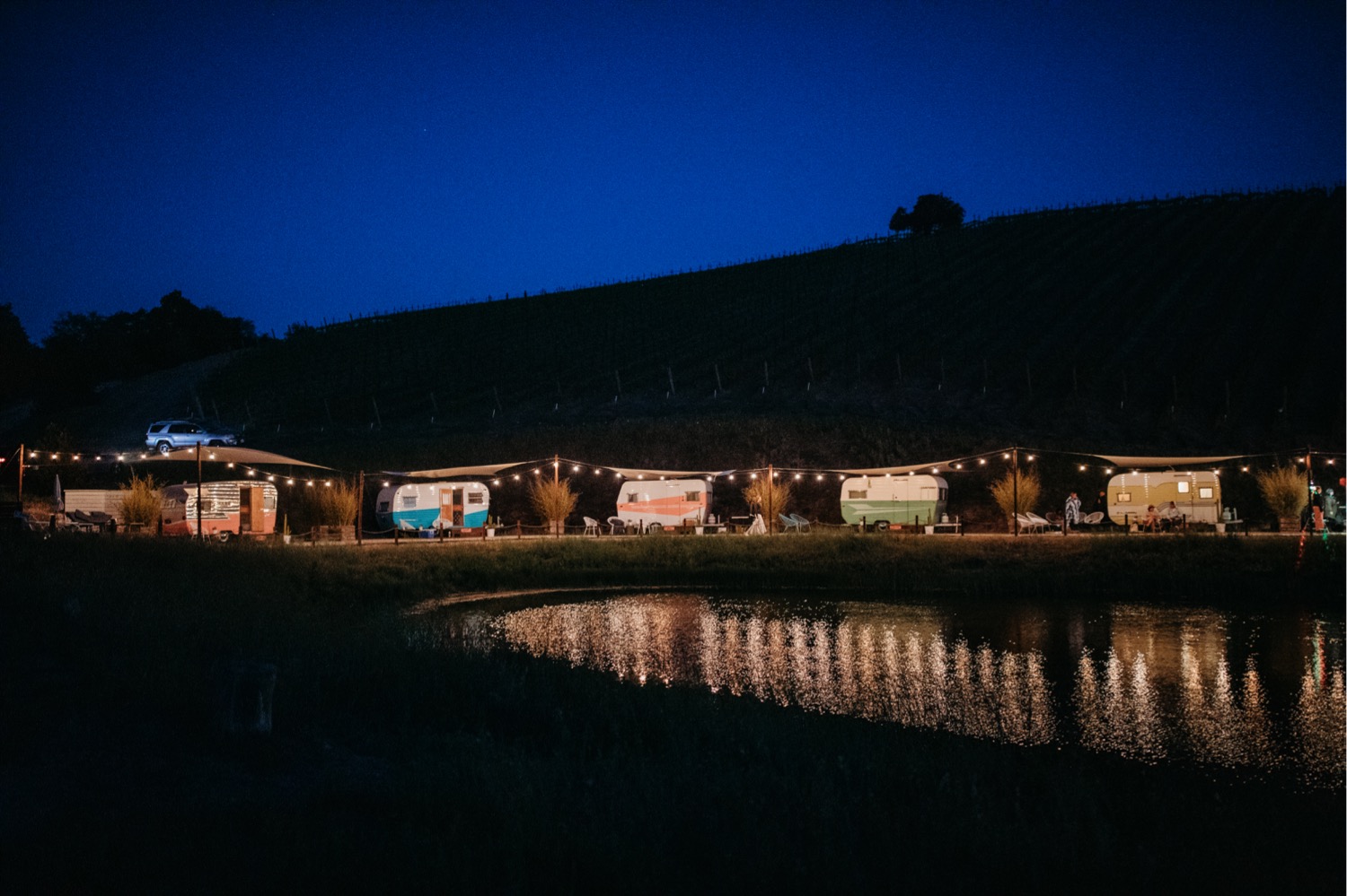 The lights of the Trailer Pond at Alta Colina after dark. Liz Koston Photography.