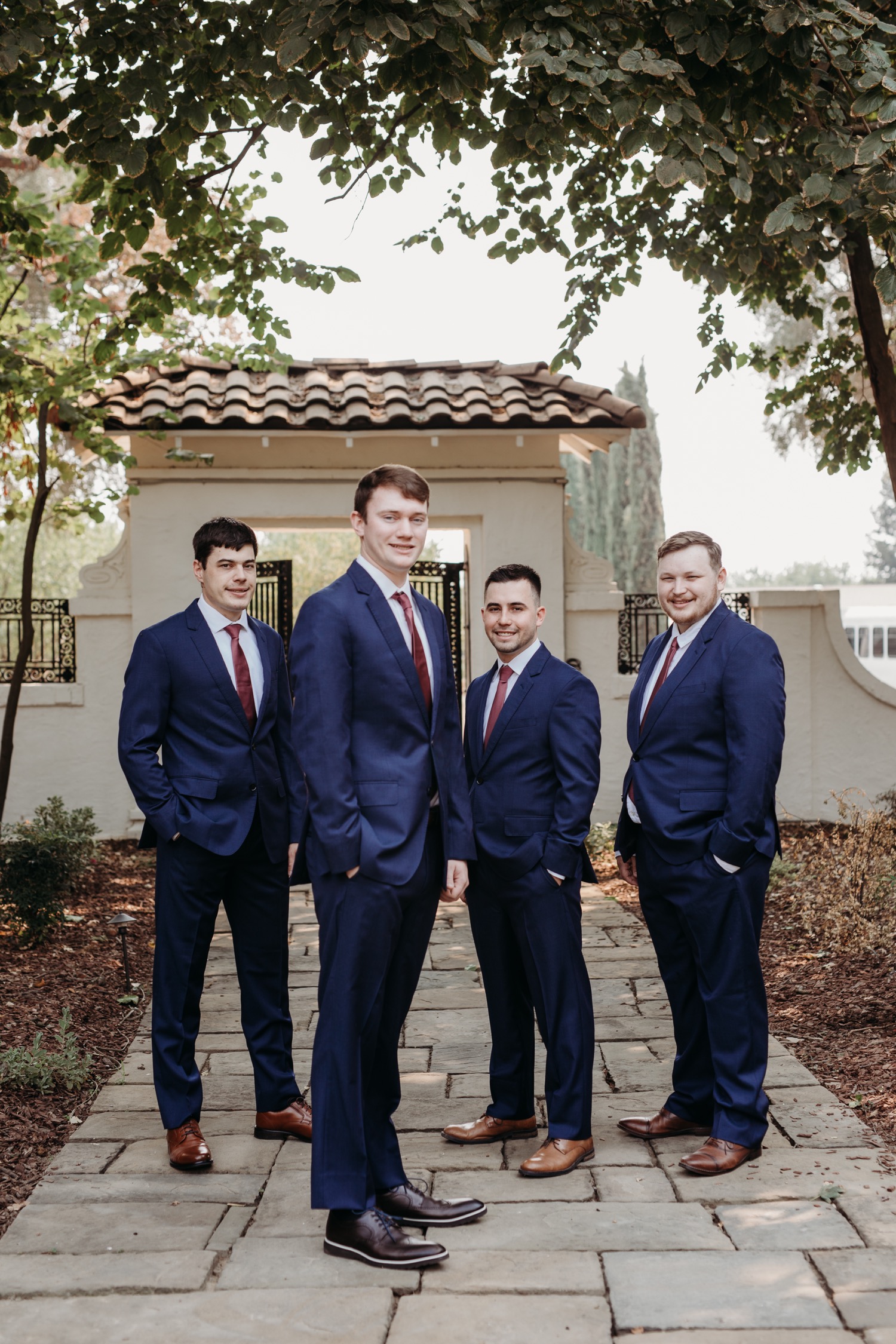 Groom and his groomsmen in their suits pre-wedding at The Maples in Woodland, CA
