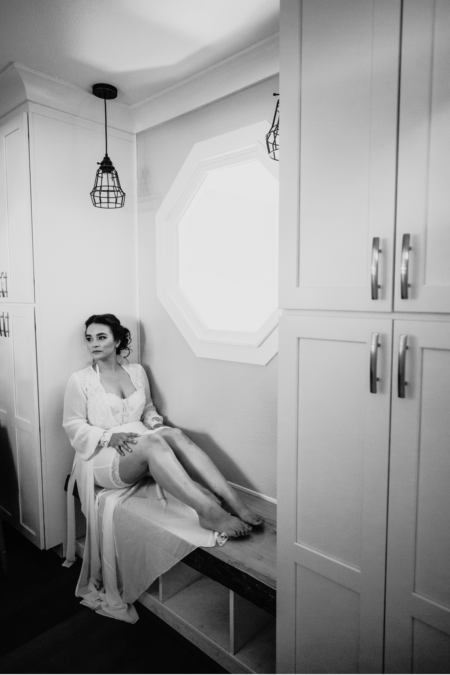 Bride sitting in her robe as she gets ready for her Yosemite wedding