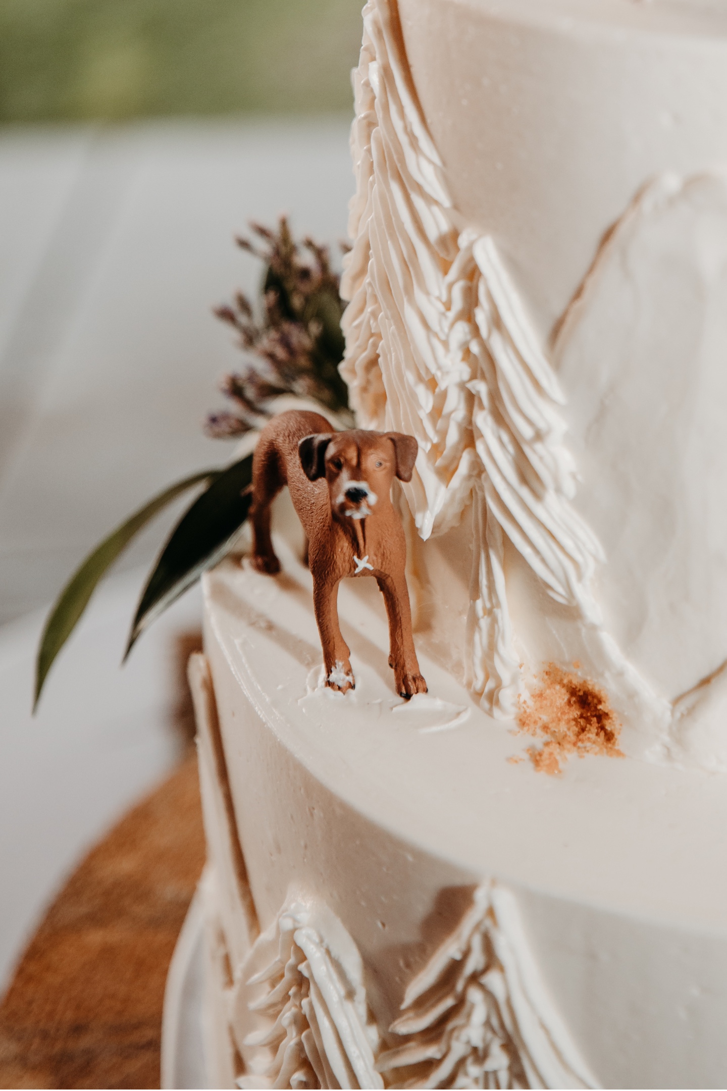Wedding cake detail with small dog figurine