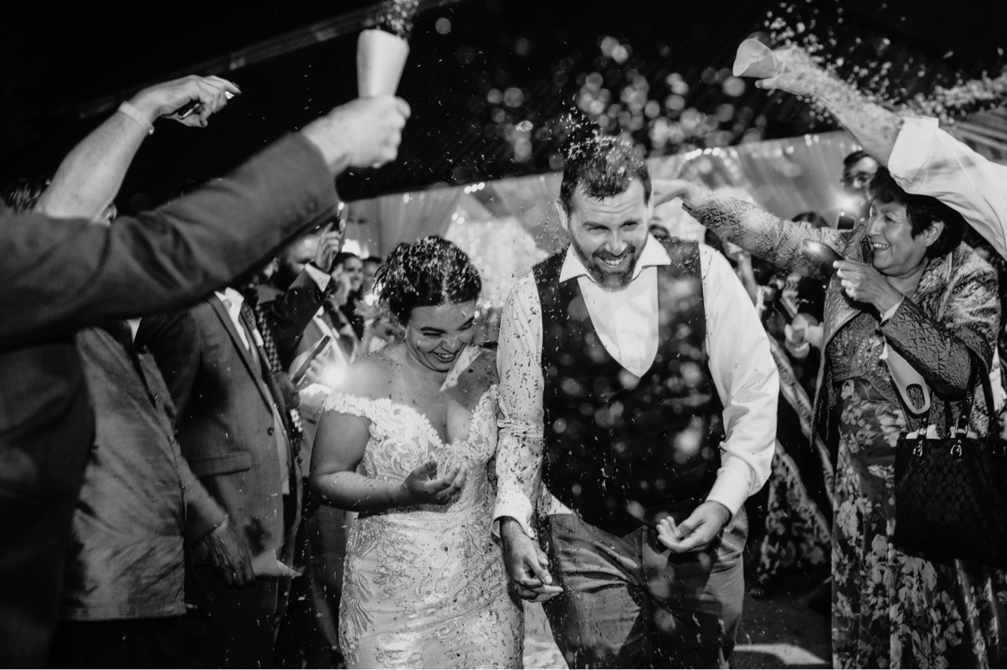 Bride and groom leave their Yosemite wedding reception under a shower of Champagne