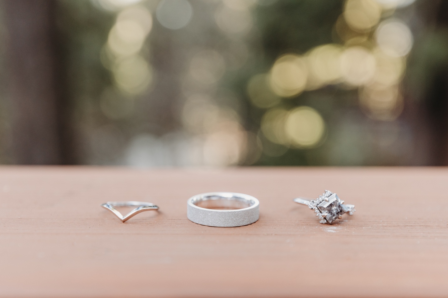 three gorgeous wedding rings in a row by Yosemite elopement photographer Liz Koston