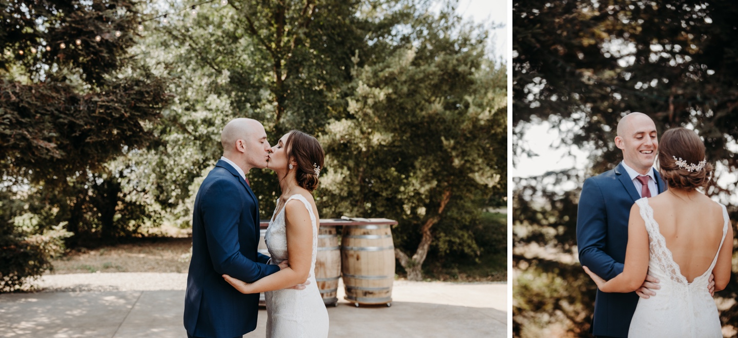 Bride and groom, Kira and Jeff, kiss for their first look. Wedding photography in Sacramento by Liz Koston.