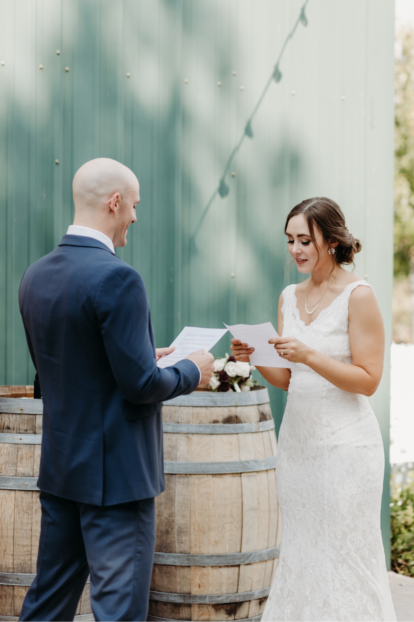 Bride and groom read letters they've written to each other before their wedding at Julietta winery. Captured by Liz Koston, Wedding photography Sacramento.