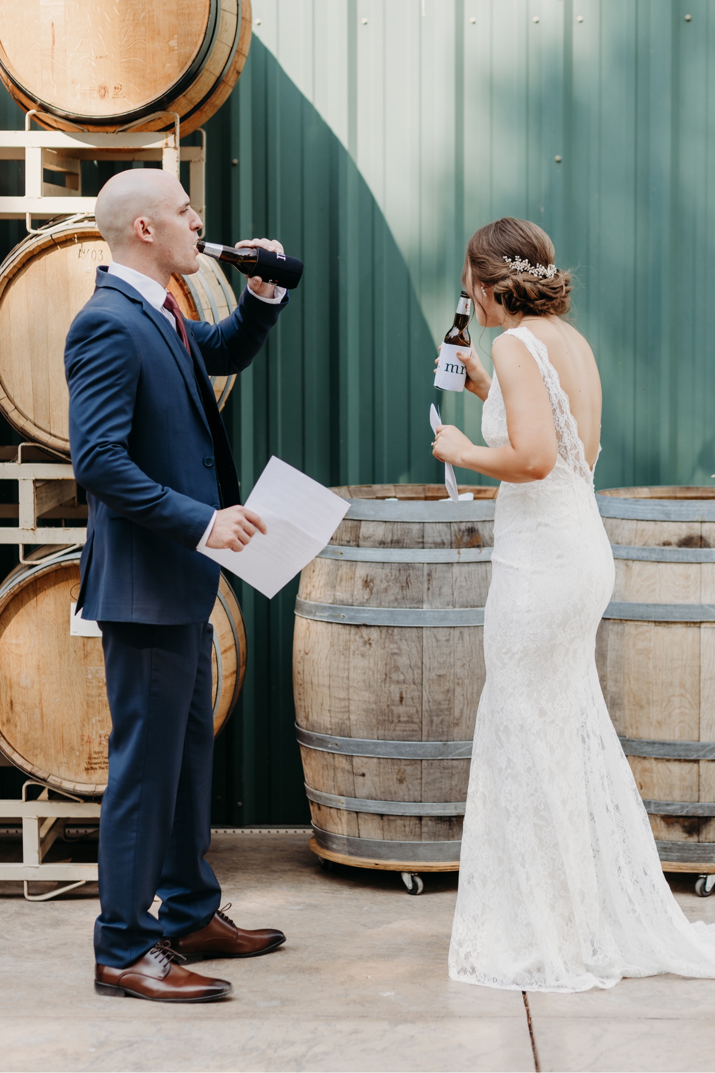 Bride and groom drink a beer after they read their wedding letters to each other. Wedding photography in Sacramento by Liz Koston.