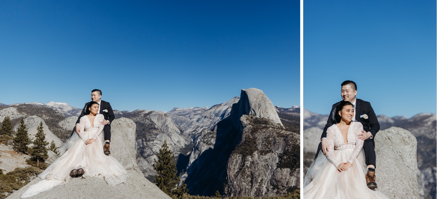 Bride and groom sit on Yosemite overlook with Half Dome in the distance. 