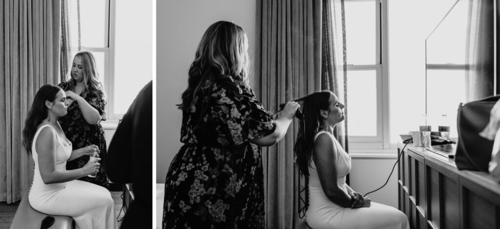 Bride sitting in her wedding dress as she gets her hair done. Photo by Liz Koston Photography.