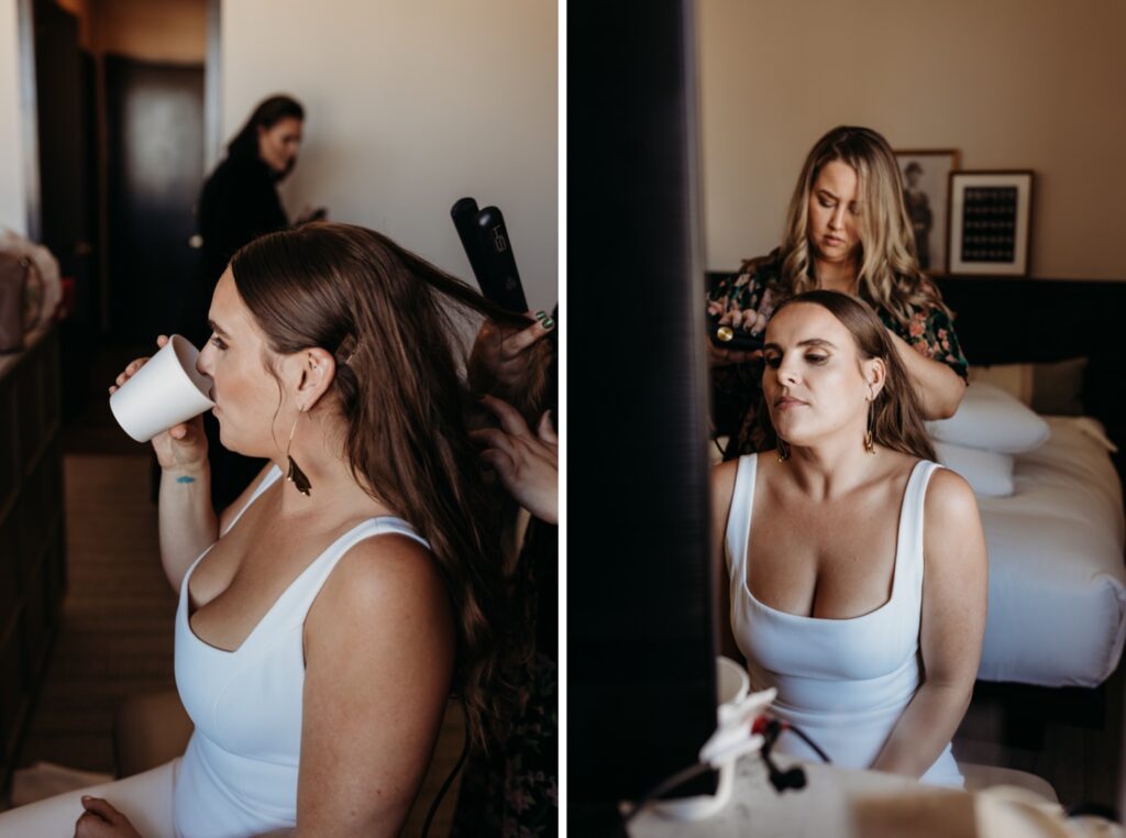 Bride gets her hair done while she drinks coffee. Photo by Liz Koston Photography.