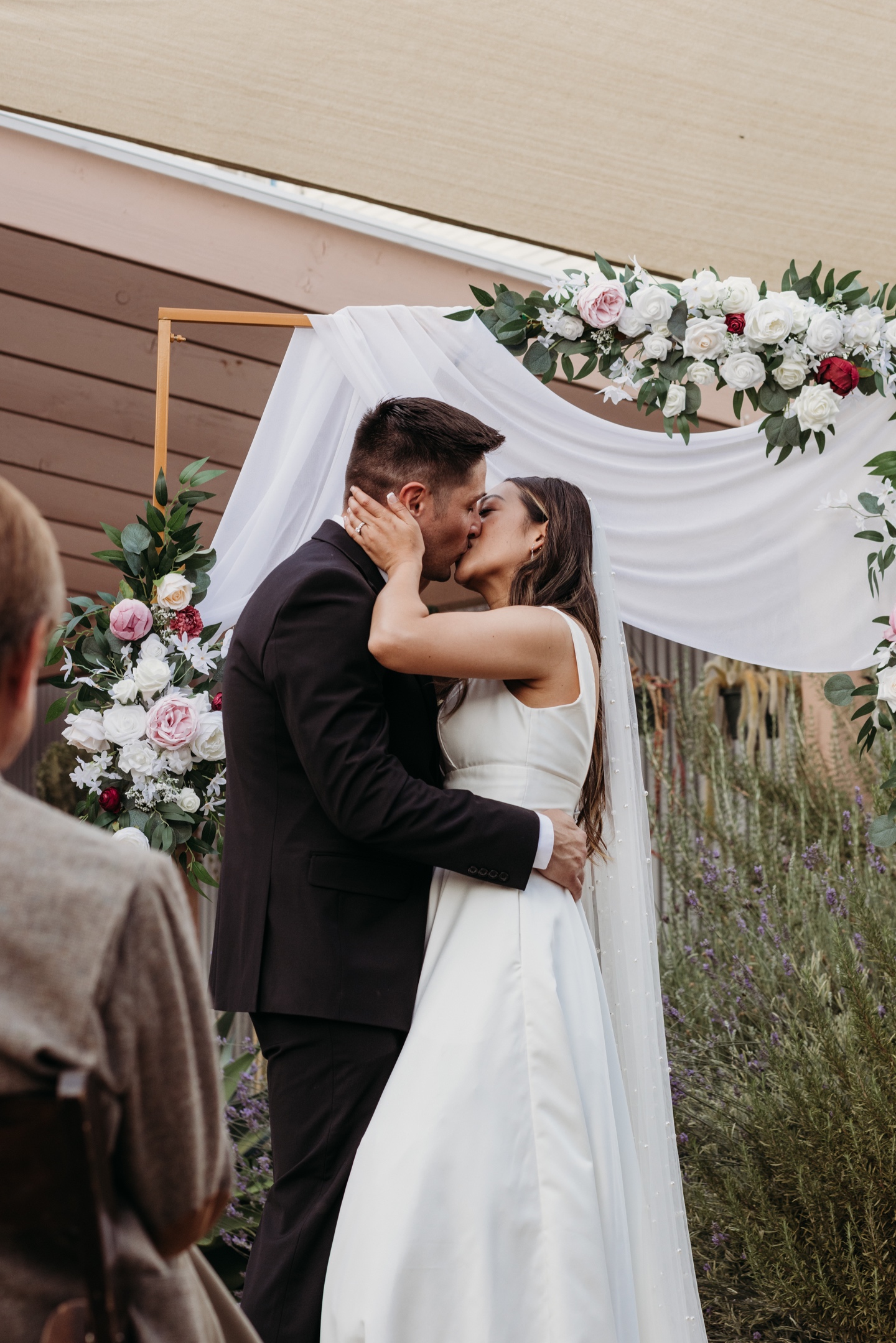 Bride and groom's first kiss as husband and wife. Liz Koston Photography.