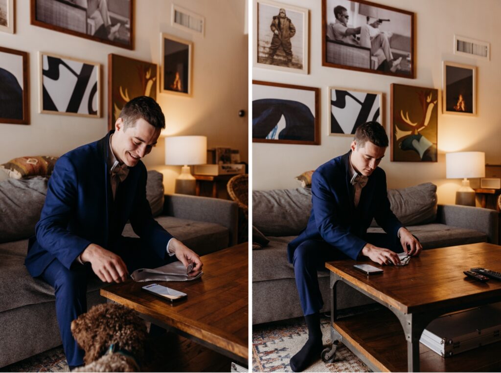 Groom folding his pocket square while his dog watches before his Lake Tahoe winter elopement. Liz Koston Photography.