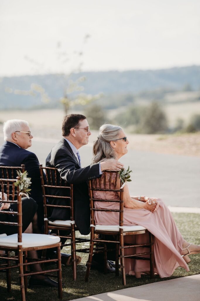 Mother of the Bride watches her daughter get married at Helwig Winery wedding. Liz Koston Photography.