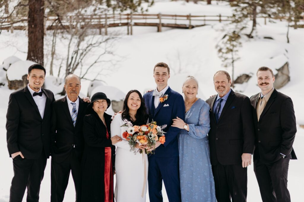 Family photo with the bride and groom after their Lake Tahoe elopement in the snow. Liz Koston Photography.