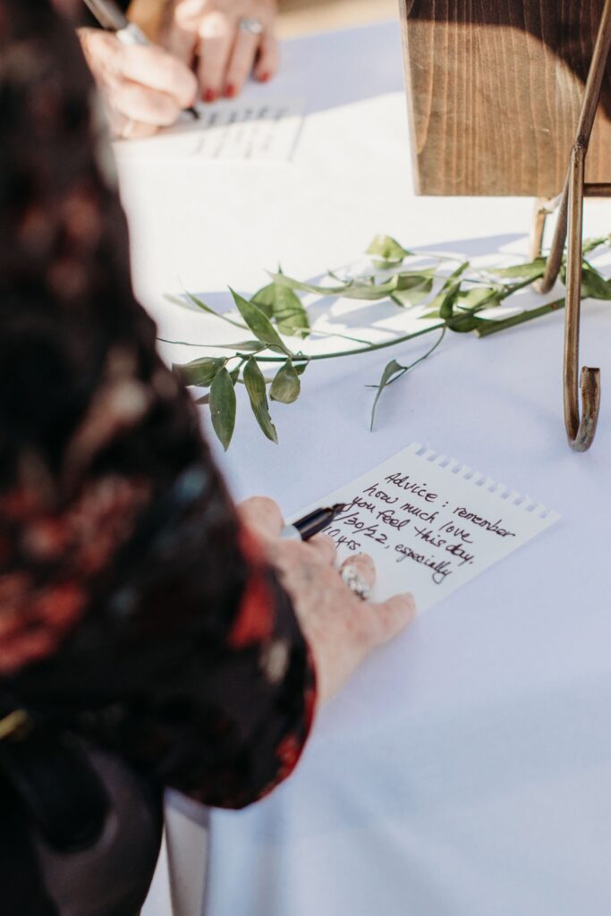 Guests write advice cards for the bride and groom. Liz Koston Photography.