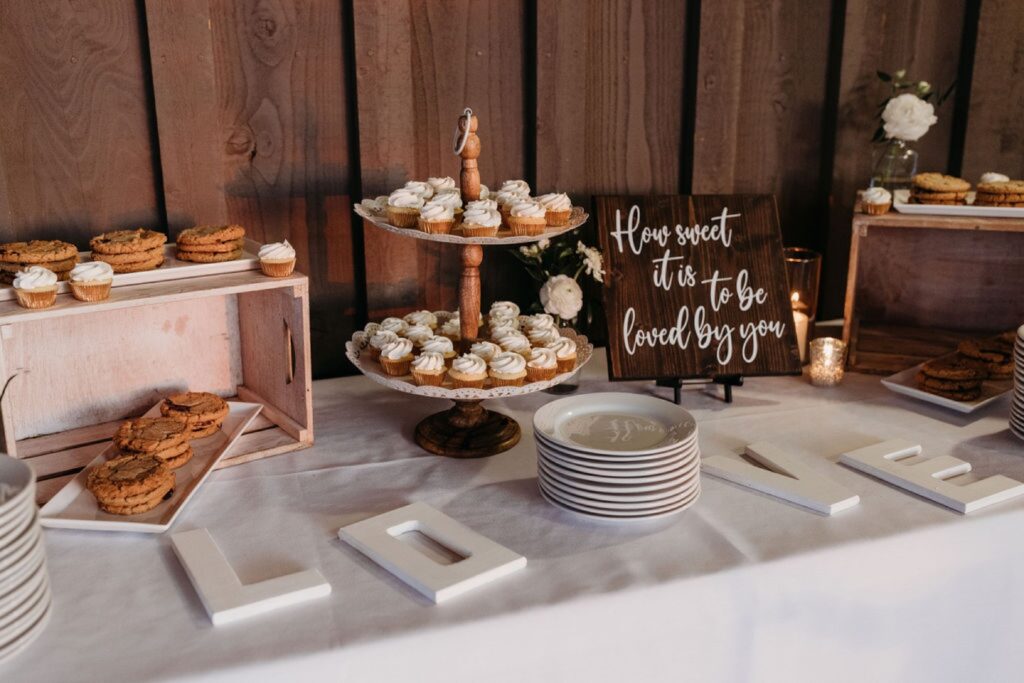 Dessert bar with cookies and cupcakes at their Helwig Winery wedding reception. Liz Koston Photography.
