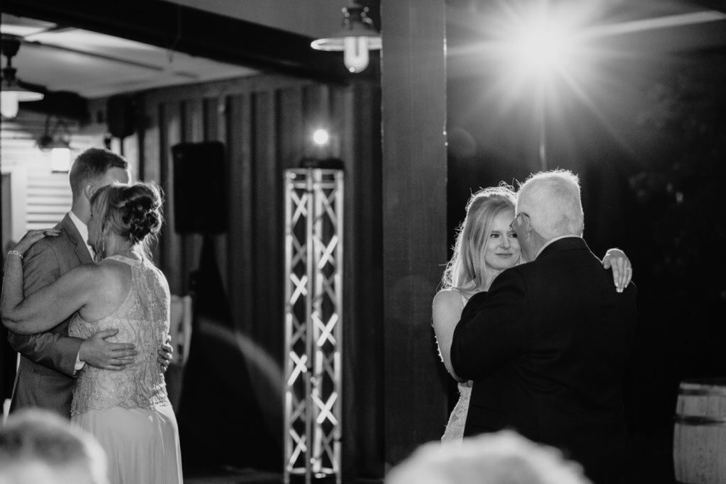 Father/Daughter and Mother/Son dance at the bride and groom's Helwig Winery wedding. Liz Koston Photography.