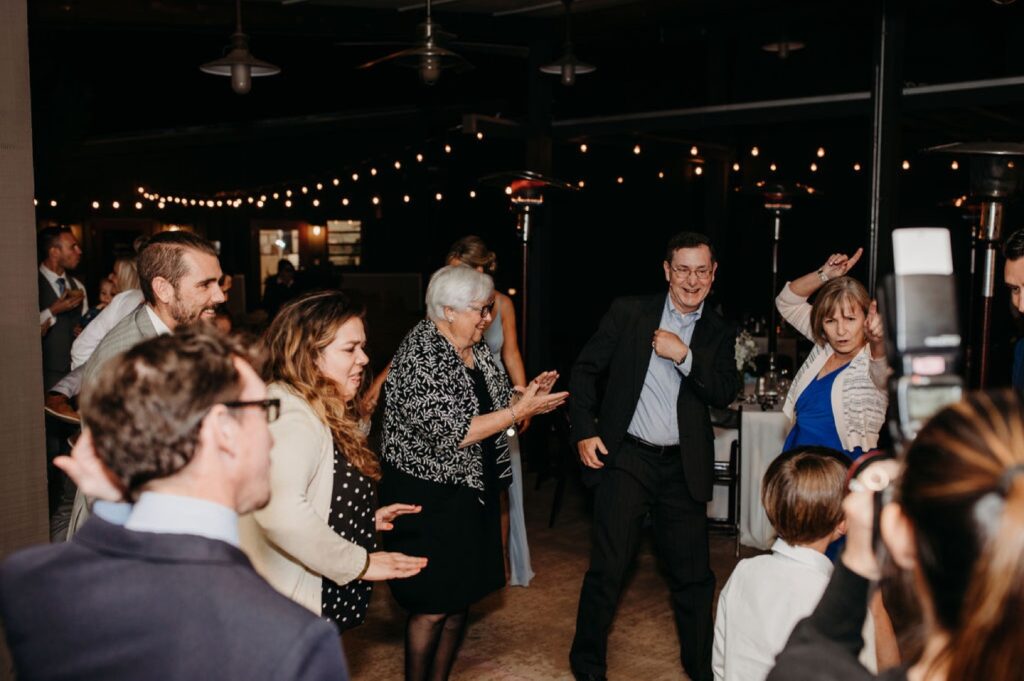 Guests dance at the couple's Helwig Winery wedding reception. Liz Koston Photography.
